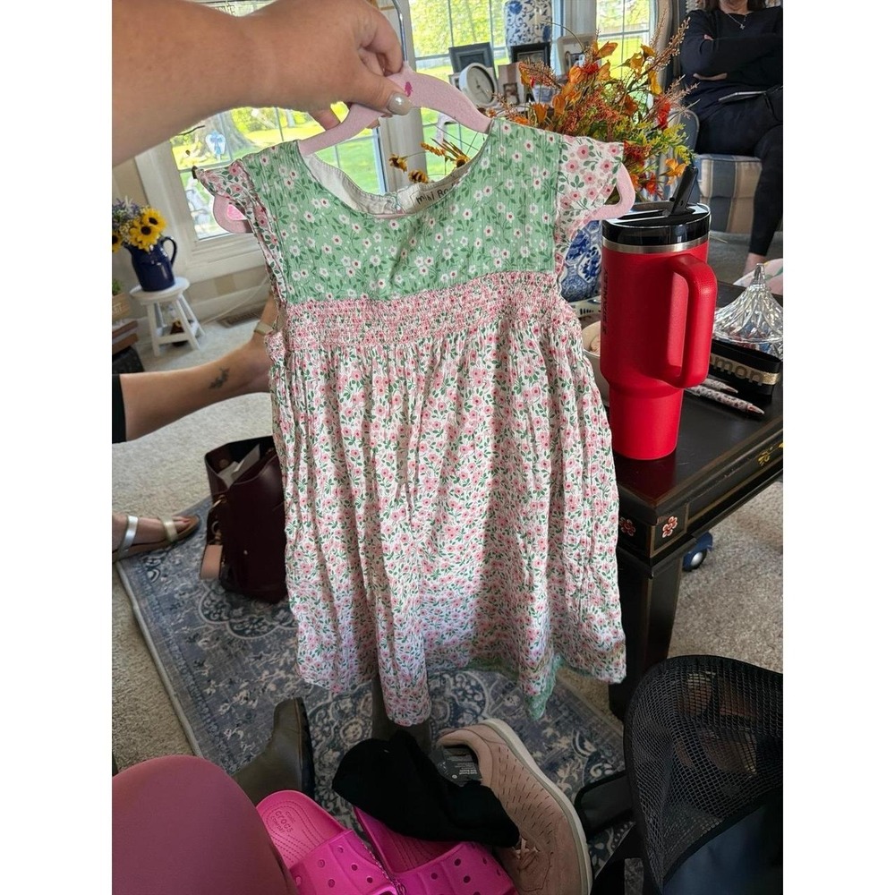 Mini Boden Girls' Floral Smocked Dress featuring a green floral 7-8